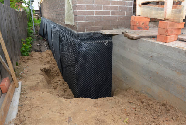 Happy homeowners after waterproofing job in Alfred